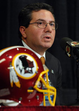 Dan Snyder speaks before a Redskins helmet