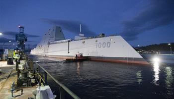 In this image provided by the U.S. Navy the Zumwalt-class guided-missile destroyer DDG 1000 is floated out of dry dock at the General Dynamics Bath Iron Works shipyard Oct. 28, 2013. The ship that bears his name, the first of three Zumwalt-class destroyers, was christened by Zumwalt's two daughters on Saturday April 12, 2014 at Bath Iron Works.