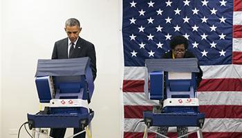 In this Oct. 20, 2104 file photo, President Barack Obama votes early for the midterm election at the Dr. Martin Luther King Community Service Center in Chicago. President Barack Obama is hitting the black radio airwaves to plead for midterm votes.