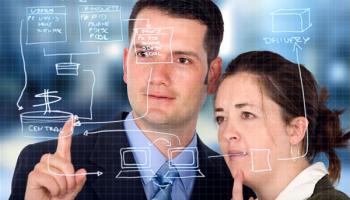 a man and woman considering business information