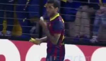 Barcelona defender Dani Alves responded to a racist taunt Sunday in a game at Villarreal by picking up a banana that landed at his feet, peeling and then eating it before proceeding to take a corner kick.