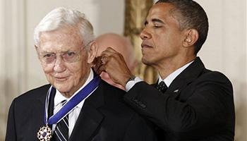 In this May 29, 2012 file photo, President Barack Obama awards the Medal of Freedom to John Doar, who handled civil rights cases in the 1960's, during a ceremony in the East Room of the White House in Washington. Doar, who as a top Justice Department civil rights lawyer in the 1960s fought to protect the rights of black voters and integrate universities in the South, died Tuesday at age 92.