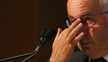 Italian Soccer Federation (FIGC) newly elected president Carlo Tavecchio adjusts his glasses at the end of the national elective assembly at Fiumicino, near Rome, Monday, Aug. 11, 2014. Carlo Tavecchio has been elected the new president of the Italian football federation, replacing Giancarlo Abete. Despite allegations of racism marring his electoral campaign, Tavecchio beat Demetrio Albertini by a majority vote on Monday.