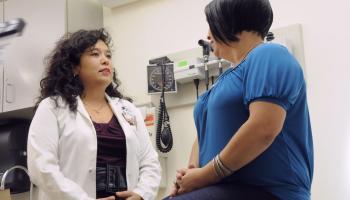 A Latina doctor and patient