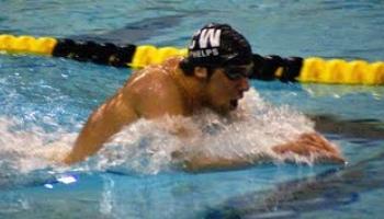 man swimming in pool