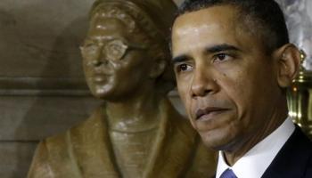 President Obama standing in front of Rosa Parks statue