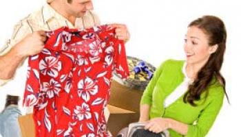 man and woman inspecting items for sale