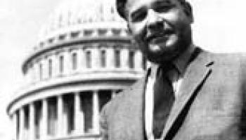 Dalip Singh Saund standing in front of U.S. Capitol