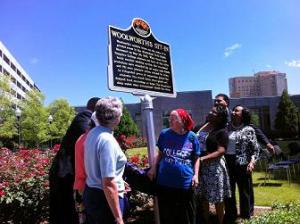 The historical marker on the site of the former Woolworth