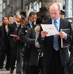 man reading paper while standing in line of people