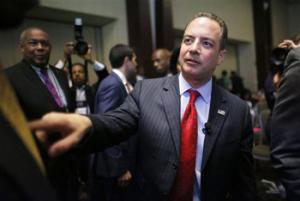 Chairman of the Republican National Committee Reince Priebus, center, speaks with people in the audience after addressing the crowd at the National Association of Black Journalists convention, Thursday, July 31, 2014, in Boston. Priebus says the GOP has been working to better compete for black and minority votes as it eyes the 2016 presidential race.