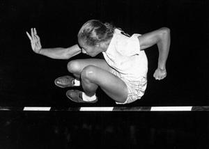 This July 8, 1948, file photo shows Alice Coachman of Albany, Ga., clearing the bar at five feet to win the running high jump in the Women's National Track Meet in Grand Rapids, Iowa. The first black woman to win an Olympic gold medal, Coachman Davis, died early Monday, July 14, 2014, in south Georgia. She was 90.