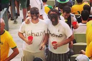 The World Cup highlights the racism issues that pervade Brazil. Shown here are two fans in black face.