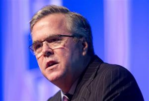 This Jan. 29, 2014 file photo shows former Florida Gov. Jeb Bush speaking in Hollywood, Fla. With three little words, Bush set off a fury that serves as a potent reminder of how difficult the immigration issue remains for the potential presidential contender and the GOP. Bush, the Republican establishment's preferred White House hopeful, described illegal immigration as an “act of love” by people hoping to provide for their families. The backlash from his own party was swift and stinging.