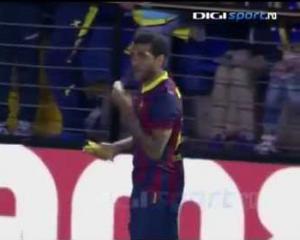 Barcelona defender Dani Alves responded to a racist taunt Sunday in a game at Villarreal by picking up a banana that landed at his feet, peeling and then eating it before proceeding to take a corner kick.