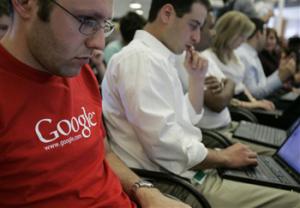 In this May 30, 2007 file photo, Google employees work on their laptops at Google headquarters in Mountain View, Calif. In a groundbreaking disclosure, Google on Wednesday, May 28, 2014 revealed how very white and male its workforce is — just 2 percent of its Googlers are black, 3 percent are Hispanic, and 30 percent are women.