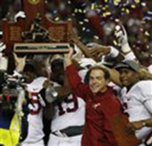 Alabama head coach Nick Saban and players celebrate after the second half of the Southeastern Conference championship NCAA college football game against Missouri, Saturday, Dec. 6, 2014, in Atlanta. Alabama won 42-13.