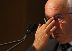 Italian Soccer Federation (FIGC) newly elected president Carlo Tavecchio adjusts his glasses at the end of the national elective assembly at Fiumicino, near Rome, Monday, Aug. 11, 2014. Carlo Tavecchio has been elected the new president of the Italian football federation, replacing Giancarlo Abete. Despite allegations of racism marring his electoral campaign, Tavecchio beat Demetrio Albertini by a majority vote on Monday.