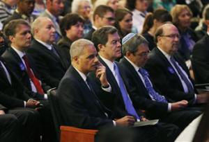 United States Attorney General Eric Holder rubs his eye during an Interfaith Service of Unity and Hope at the Jewish Community Center in Overland Park, Kan., Thursday, April 17, 2014. Frazier Glenn Cross, 73, is charged with the killings Sunday of Dr. William Lewis Corporon and his grandson, Reat Griffin Underwood, outside the Jewish Community Center of Greater Kansas City. Cross is also accused of killing Terri LaManno at a nearby Jewish retirement complex.