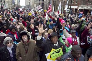 Rev. Jerry Dowdy of Carthage, N.C. sings with thousands of others at the "Moral March on Raleigh" on Fayetteville Street in Raleigh on Saturday, Feb. 8, 2014. Nearly 200 organizations are joining the National Association for the Advancement of Colored People in the "Moral March on Raleigh," a new name for the "Historic Thousands on Jones Street," as it was originally called. Jones Street referred to the street where the Legislative Building stands and the usual terminus of the march.