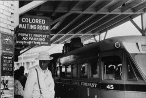 Sign at train station showing waiting room for colored-only