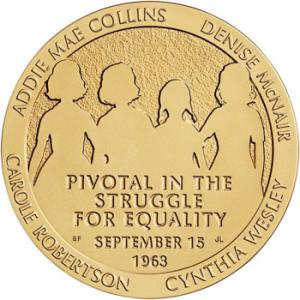 gold medal depicting the four girls killed