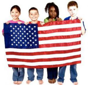 children of various ethnicities holding an American flag