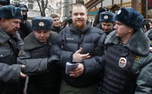 Police officers detain Dmitry Demushkin