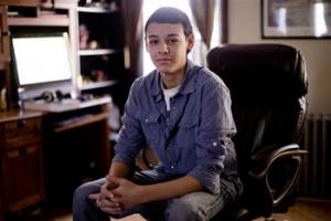 High school student Vito Calli, 15, poses for a portrait by his computer, Wednesday, Nov. 20, 2013, at his home in Reading, Pa. In a shift in attitude, most young people now say it's wrong to use racist or sexist slurs online, even if you're just kidding. But when they see them, they don't take much personal offense. Calli, whose family emigrated from Argentina, says people tease him online with jokes about Hispanics, but "you can't let those things get to you."