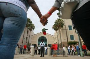 protestors holding hands