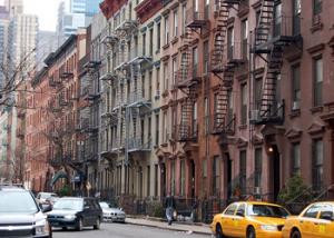 A class-action lawsuit claims New York City's property tax system unfairly discriminates against blacks and Hispanics living in rental buildings.